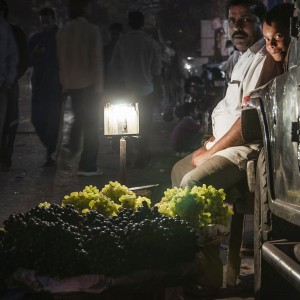 father and son selling fruits in Delhi, India